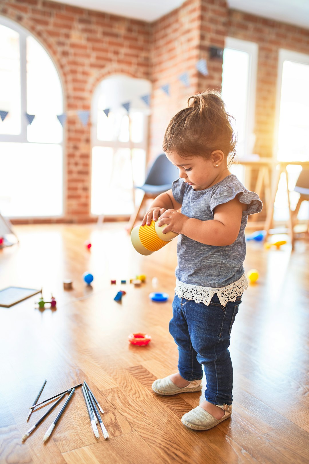 Children playing with physical toys